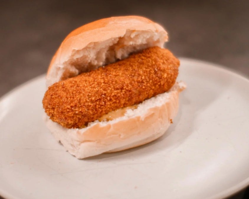 Super Pasta beef kroket in a soft bun, available on the Dutch snacks menu